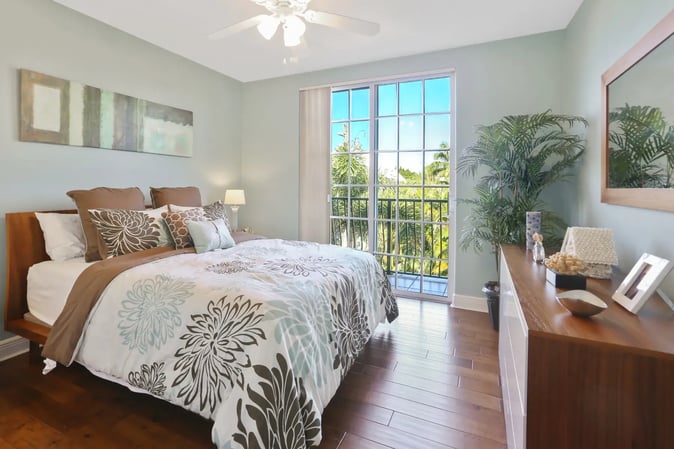 whole-home-remodel-southwest-florida-bedroom-balcony-view